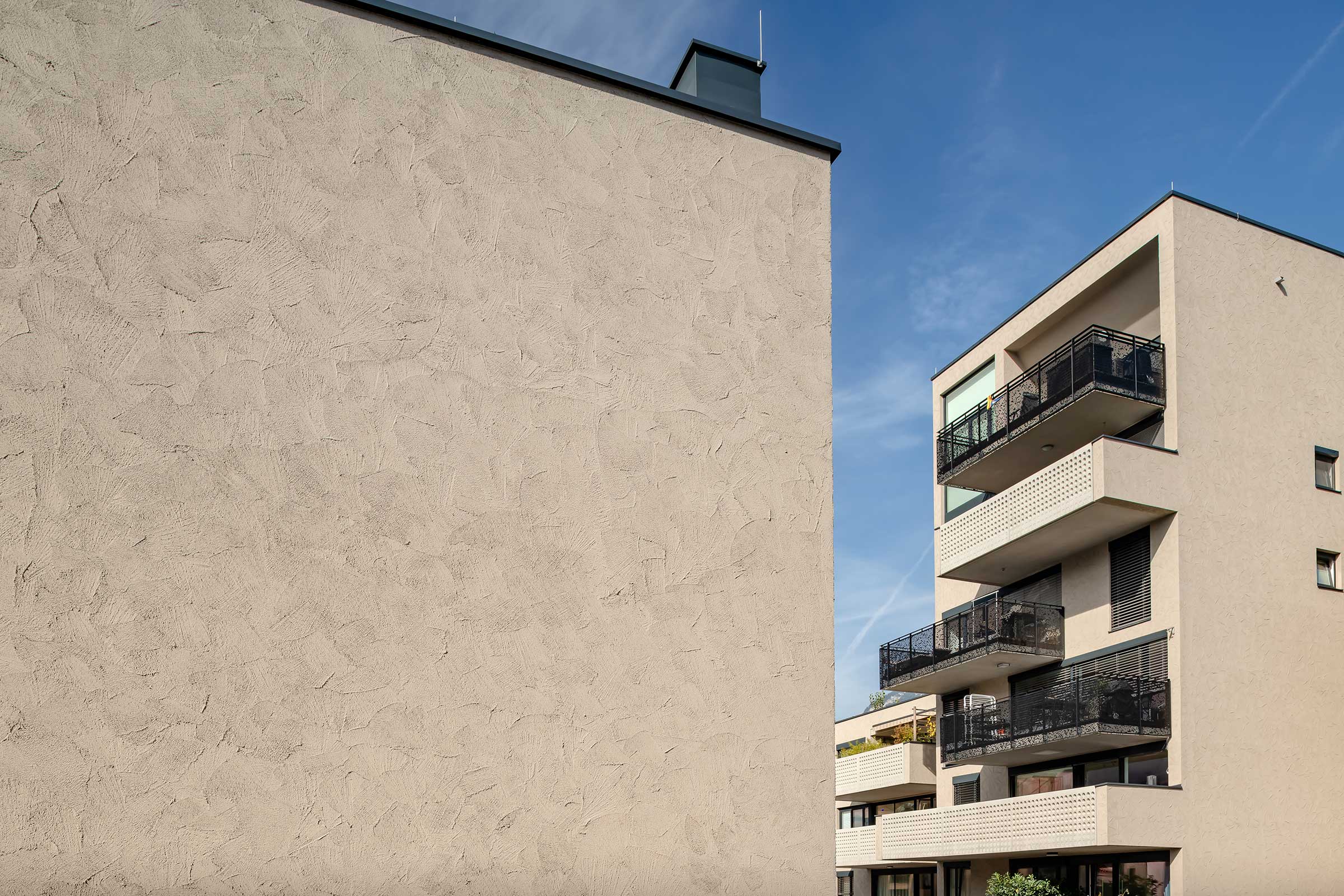 Sierpleister met troffelafwerking: Stolit Effect® als StoSignature Texture, woningen in Innsbruck 