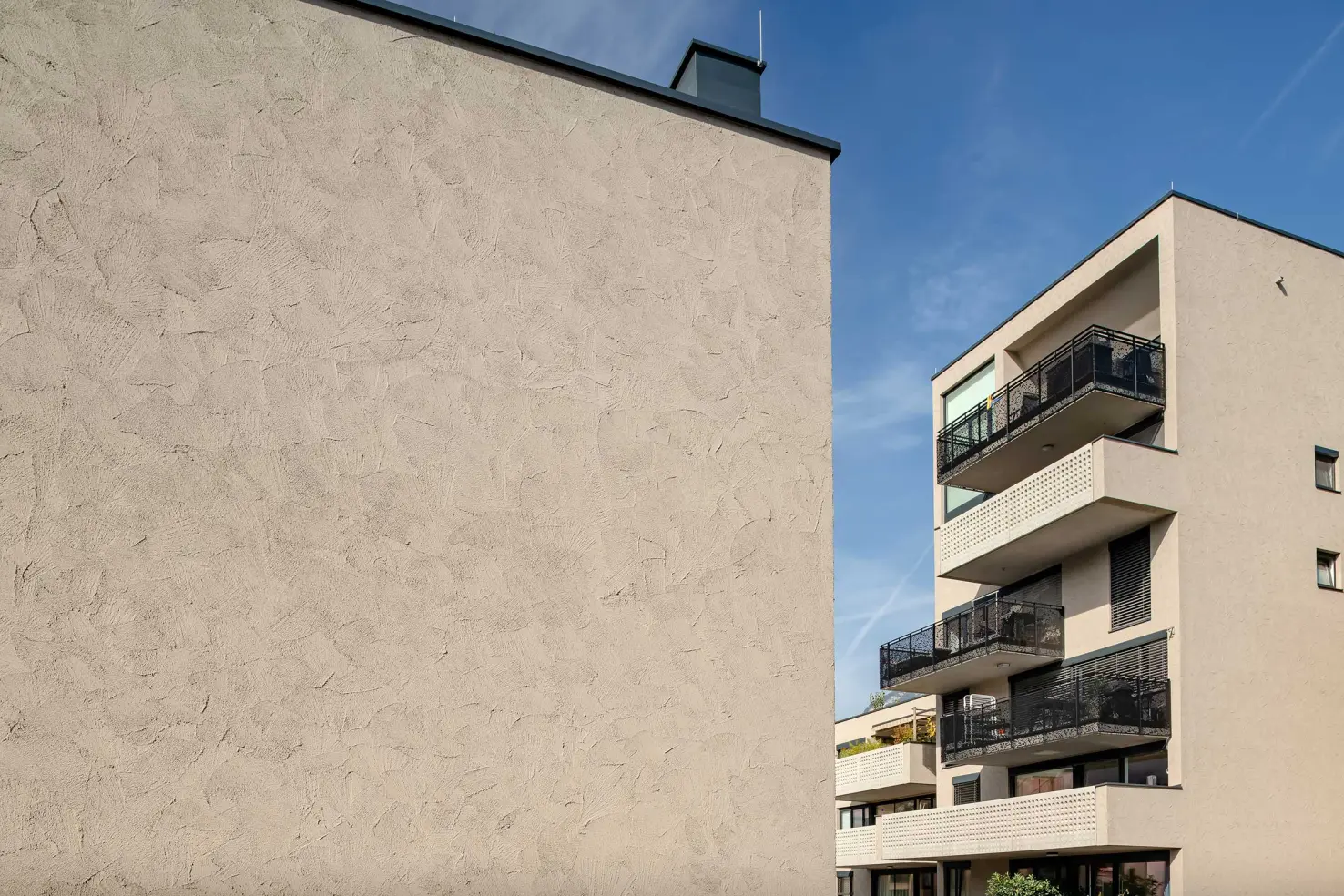 Close-up shot of architecture: rendered facade, coated with StoSignature Texture