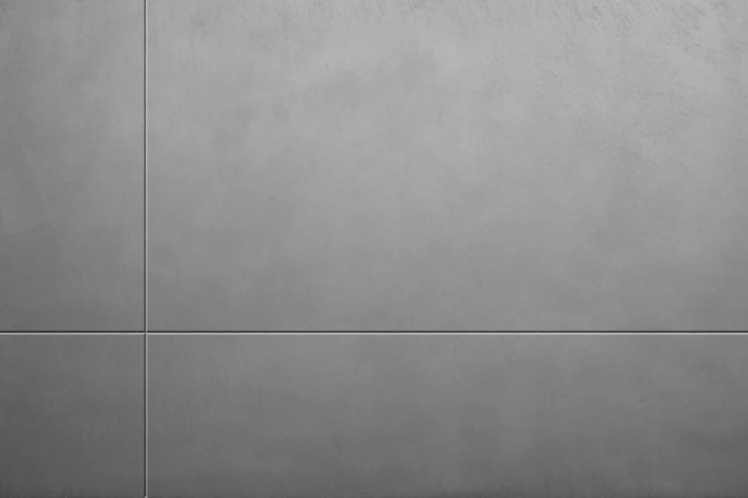 Außenputz Betonoptik StoSignature, graue Putzoberfläche mit Sichtbeton-Charakter